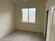 Well-lit bedroom with window and closet at 7668 E Thunderhawk Rd, Scottsdale, AZ 85255