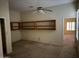 Bedroom with built-in shelving and ceiling fan at 7668 E Thunderhawk Rd, Scottsdale, AZ 85255