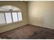 Spacious bedroom with large window and plantation shutters at 7668 E Thunderhawk Rd, Scottsdale, AZ 85255