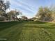 Greenbelt with a scenic walking path and bridge at 7668 E Thunderhawk Rd, Scottsdale, AZ 85255