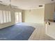 Living room with tile flooring and sliding glass doors at 7668 E Thunderhawk Rd, Scottsdale, AZ 85255