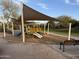 Community playground with shade structure and benches at 7668 E Thunderhawk Rd, Scottsdale, AZ 85255