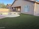 Residential backyard with a swimming pool and artificial turf at 7668 E Thunderhawk Rd, Scottsdale, AZ 85255