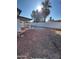 Backyard with gravel, a partial view of a patio, and a block wall at 7685 W San Miguel Ave, Glendale, AZ 85303