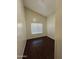 Bright bedroom with dark wood flooring and window at 7685 W San Miguel Ave, Glendale, AZ 85303