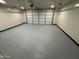 Attached garage with overhead door and ample space at 7685 W San Miguel Ave, Glendale, AZ 85303