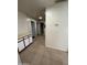 Clean hallway with tile floors and access to bedrooms at 7685 W San Miguel Ave, Glendale, AZ 85303