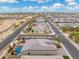 Aerial view of a house with a pool in a neighborhood at 7718 W Raymond St, Phoenix, AZ 85043