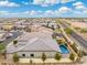 Aerial view showcasing a single-Gathering home with a large backyard and pool at 7718 W Raymond St, Phoenix, AZ 85043