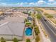 Aerial view of house with pool and neighborhood at 7718 W Raymond St, Phoenix, AZ 85043