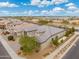 Aerial view of a single-Gathering home in a quiet residential neighborhood at 7718 W Raymond St, Phoenix, AZ 85043