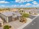 Aerial view of a single-Gathering home with a two-car garage and driveway at 7718 W Raymond St, Phoenix, AZ 85043