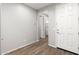 Light and airy entryway with wood-look flooring at 7718 W Raymond St, Phoenix, AZ 85043