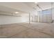 Garage interior with support beam, lighting, and storage racks at 7718 W Raymond St, Phoenix, AZ 85043