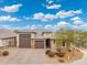 Beautiful two-story home with a three-car garage and attractive landscaping at 7718 W Raymond St, Phoenix, AZ 85043