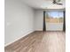 Spacious living room with hardwood floors and ceiling fan at 7718 W Raymond St, Phoenix, AZ 85043