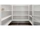 Spacious pantry with ample shelving for storage at 7718 W Raymond St, Phoenix, AZ 85043