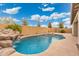 Inviting kidney-shaped pool with waterfall feature at 7718 W Raymond St, Phoenix, AZ 85043