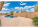 Large pool and spacious patio ideal for outdoor relaxation and entertaining at 7718 W Raymond St, Phoenix, AZ 85043