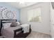 Cozy bedroom with light blue wall and window blinds at 7820 E Baseline Rd # 103, Mesa, AZ 85209