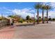 Gated community entrance with palm trees at 7820 E Baseline Rd # 103, Mesa, AZ 85209