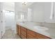 Bathroom with double sinks and wood cabinets at 7917 S 32Nd Ter, Phoenix, AZ 85042