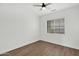 Bright bedroom with wood-look floors and window blinds at 7917 S 32Nd Ter, Phoenix, AZ 85042