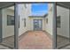 Inviting courtyard with brick pavers and double doors at 7917 S 32Nd Ter, Phoenix, AZ 85042