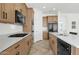 Modern kitchen with light wood cabinets and quartz countertops at 7917 S 32Nd Ter, Phoenix, AZ 85042