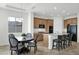 Modern kitchen with island, stainless steel appliances, and breakfast nook at 7917 S 32Nd Ter, Phoenix, AZ 85042