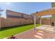 Artificial turf backyard with covered patio and block wall at 8827 W Dahlia Dr, Peoria, AZ 85381