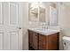 Bathroom with single vanity, dark wood cabinets, and a large mirror at 8827 W Dahlia Dr, Peoria, AZ 85381