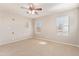 Bright bedroom featuring carpet flooring and multiple windows at 8827 W Dahlia Dr, Peoria, AZ 85381