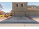 Two-story house with a two-car garage and neutral color scheme at 8827 W Dahlia Dr, Peoria, AZ 85381