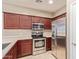 Kitchen with stainless steel appliances and wood cabinets at 8827 W Dahlia Dr, Peoria, AZ 85381