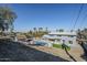 Elevated view of the home, showcasing the backyard and pool area at 925 W Fairway Dr, Mesa, AZ 85201