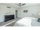 Bedroom with ceiling fan, gray carpet, dresser, and en-suite bathroom at 925 W Fairway Dr, Mesa, AZ 85201