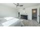 Primary bedroom with ceiling fan, dresser, and en-suite bathroom at 925 W Fairway Dr, Mesa, AZ 85201