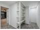 Large walk-in closet with built-in shelving at 925 W Fairway Dr, Mesa, AZ 85201