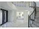 Elegant entryway with a curved staircase and marble flooring at 925 W Fairway Dr, Mesa, AZ 85201