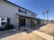 Charming two-story home with a covered entryway, freshly painted exterior, and desert landscaping at 925 W Fairway Dr, Mesa, AZ 85201