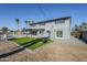 Modern two-story house featuring a lush green lawn and patio at 925 W Fairway Dr, Mesa, AZ 85201