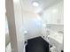 Bright laundry room features modern tile floors, a utility sink, and lots of storage at 925 W Fairway Dr, Mesa, AZ 85201