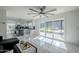 Living area with marble floors, sliding doors, and view of pool at 925 W Fairway Dr, Mesa, AZ 85201