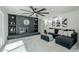 Living room with fireplace, built-in shelving, and L-shaped sectional sofa at 925 W Fairway Dr, Mesa, AZ 85201