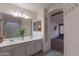 Double vanity bathroom with an open view to the adjoining room at 9325 E Fairfield St, Mesa, AZ 85207