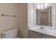 Clean bathroom featuring a toilet, mirror, modern vanity with sink, and new lighting at 9325 E Fairfield St, Mesa, AZ 85207