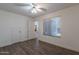 Cozy bedroom featuring neutral walls, plush carpet, bright window, and a walk-in closet at 9325 E Fairfield St, Mesa, AZ 85207