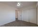 Bedroom features a walk-in closet, bright windows, and neutral paint throughout at 9325 E Fairfield St, Mesa, AZ 85207