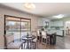 Stylish kitchen with island seating and sliding glass doors leading to the pool area at 9325 E Fairfield St, Mesa, AZ 85207